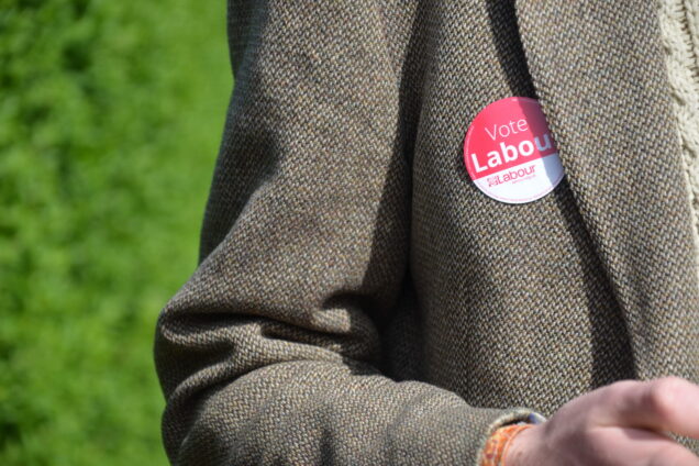 A jacket with a Vote Labour sticker on it