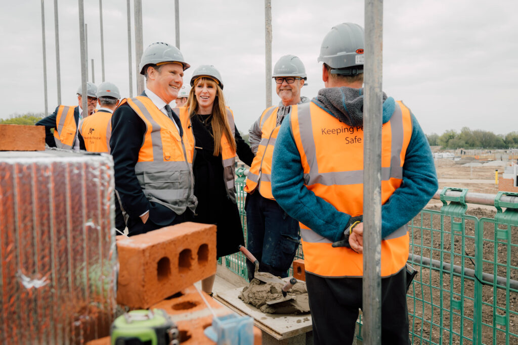 Keir Starmer and Angela Rayner meet workers on a building site