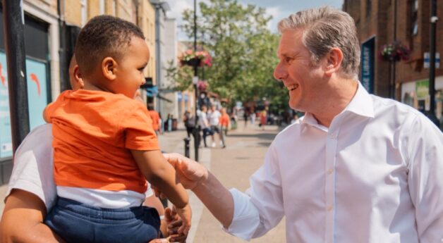 Keir Starmer meeting a father and child