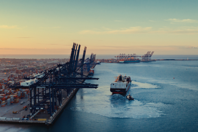 Aerial image of a British port with a ship pulling out of the harbour