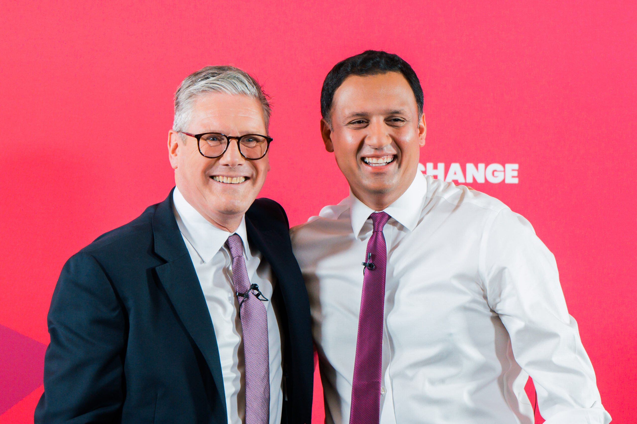 Keir Starmer and Anas Sarwar standing side by side in front of change backdrop