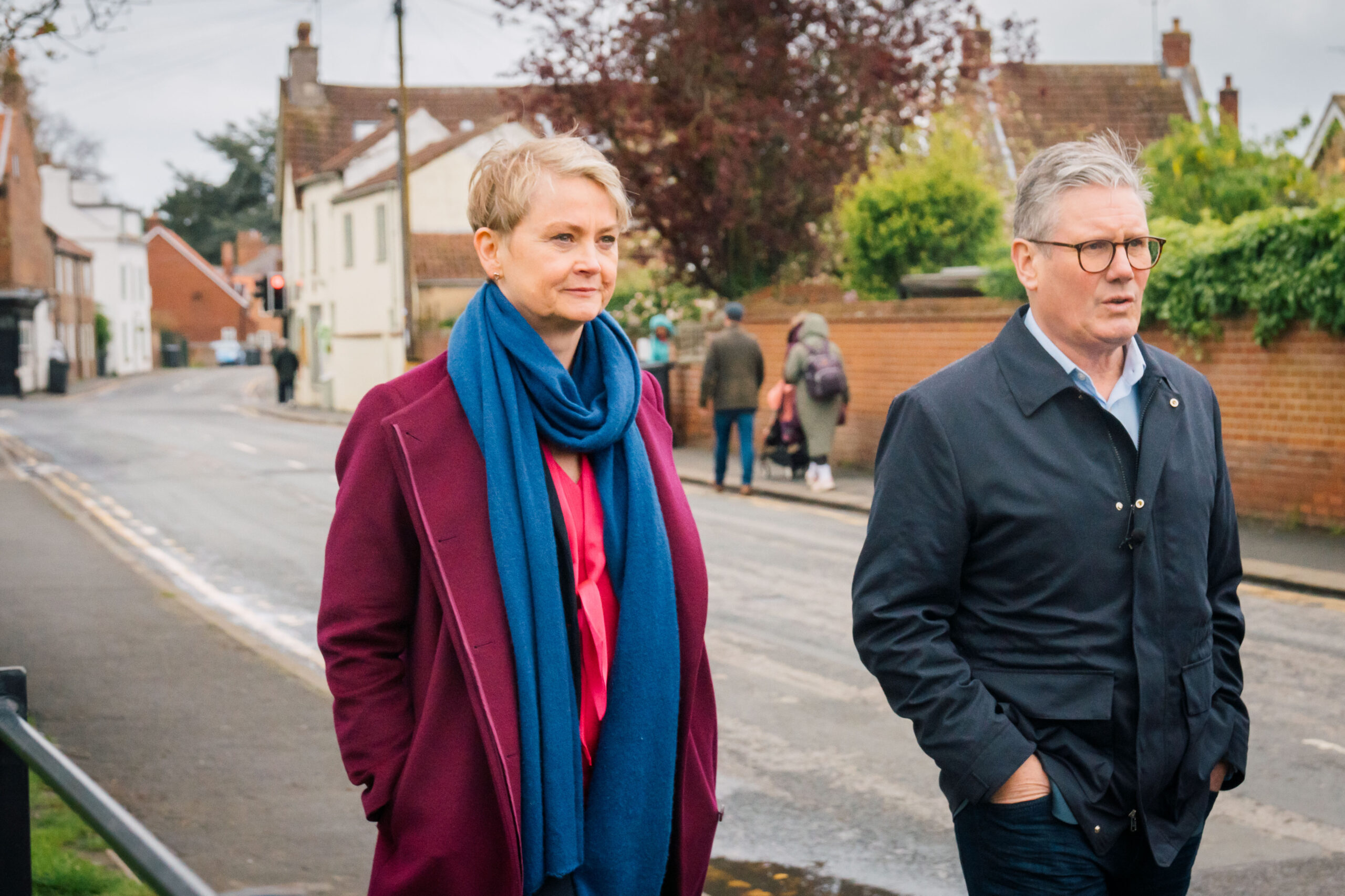 Keir Starmer and Yvette Cooper walking together down a street