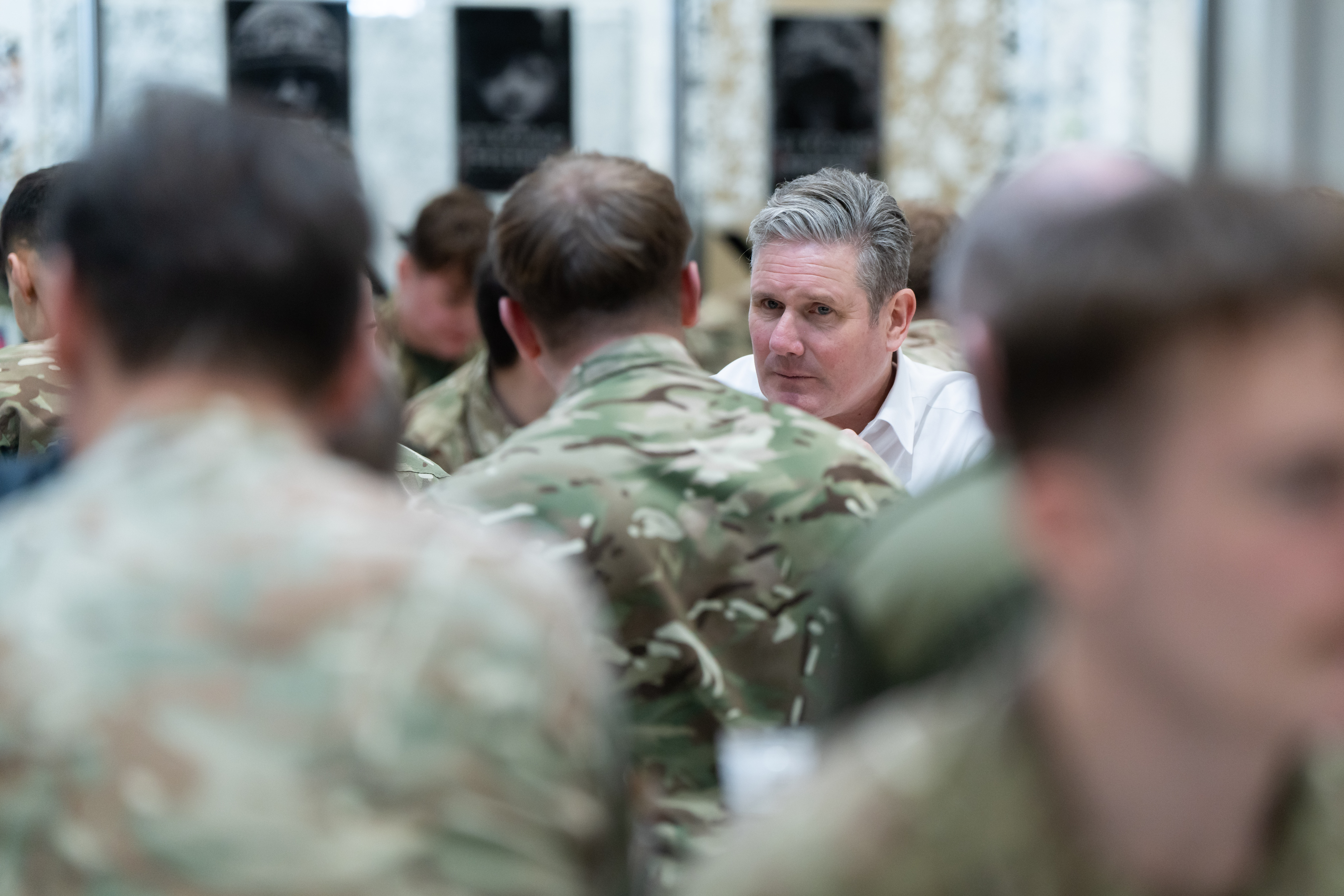 Keir Starmer talking to a soldier.