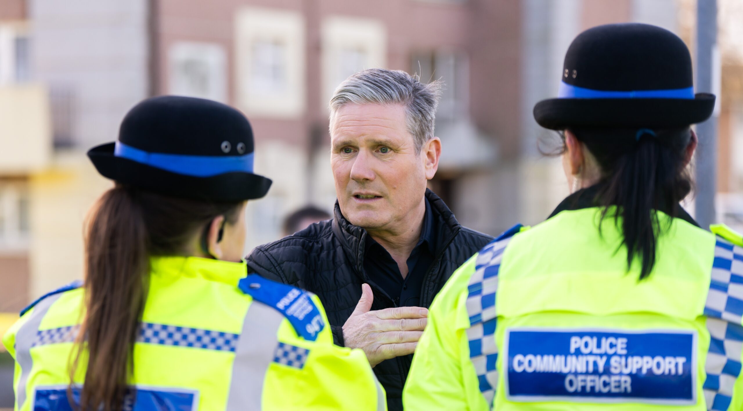 Keir Starmer talking to two Police Community Support Officers.