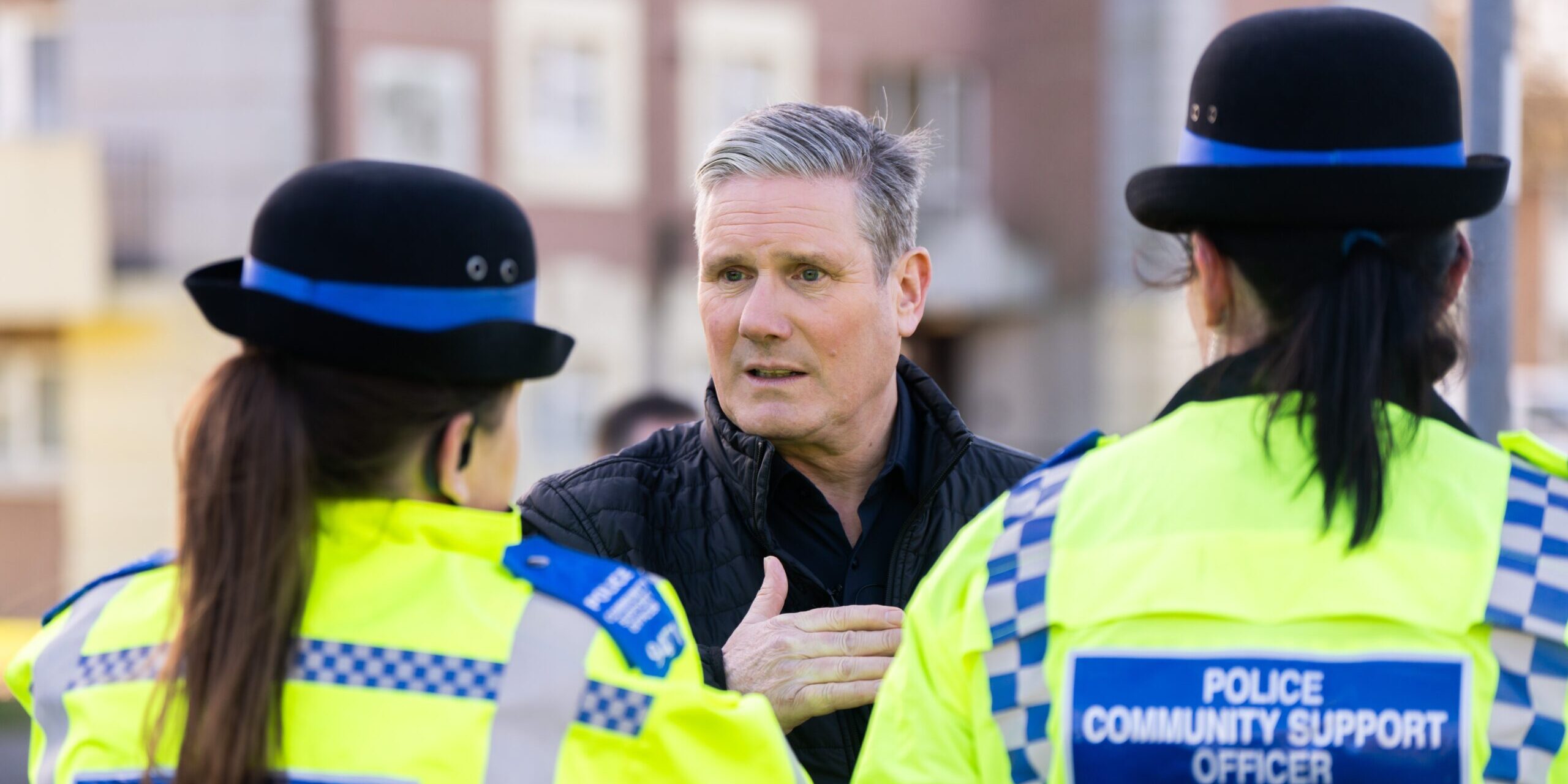 Keir Starmer talking to two Police Community Support Officers.