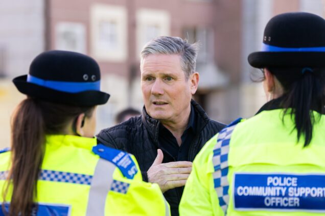 Keir Starmer talking to two Police Community Support Officers.