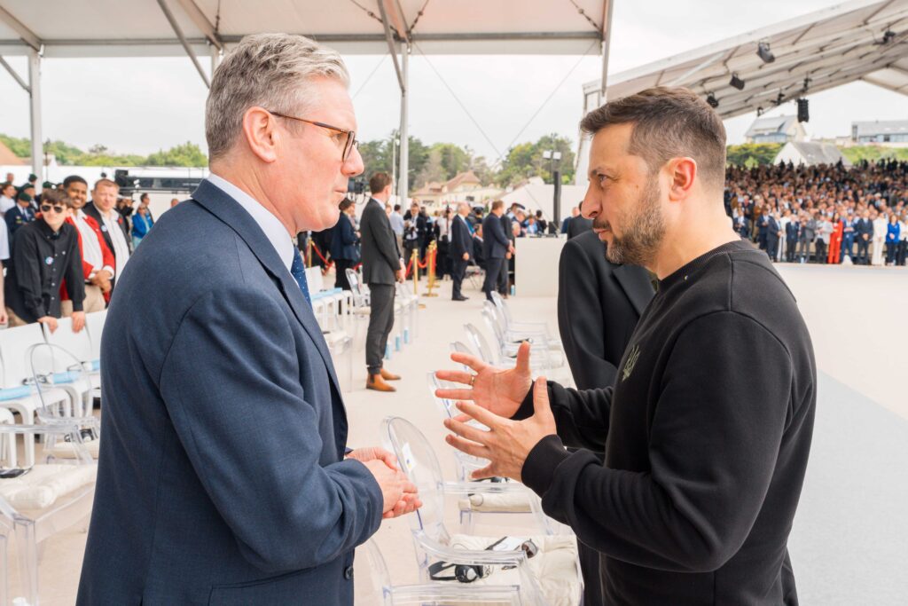 Keir Starming talking to Volodymyr Zelenskyy at the D-Day commemoration ceremony in France.