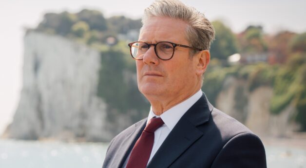 Keir Starmer standing in front of the White Cliffs of Dover.