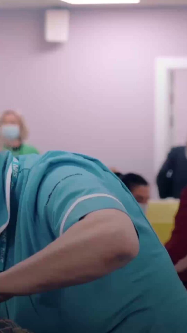 A photo of a nurse administering an injection.