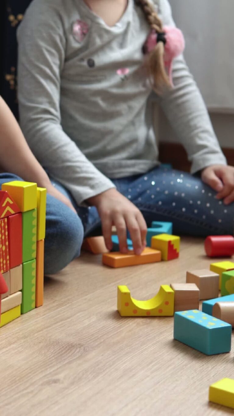 A photo of a child playing with some building blocks.