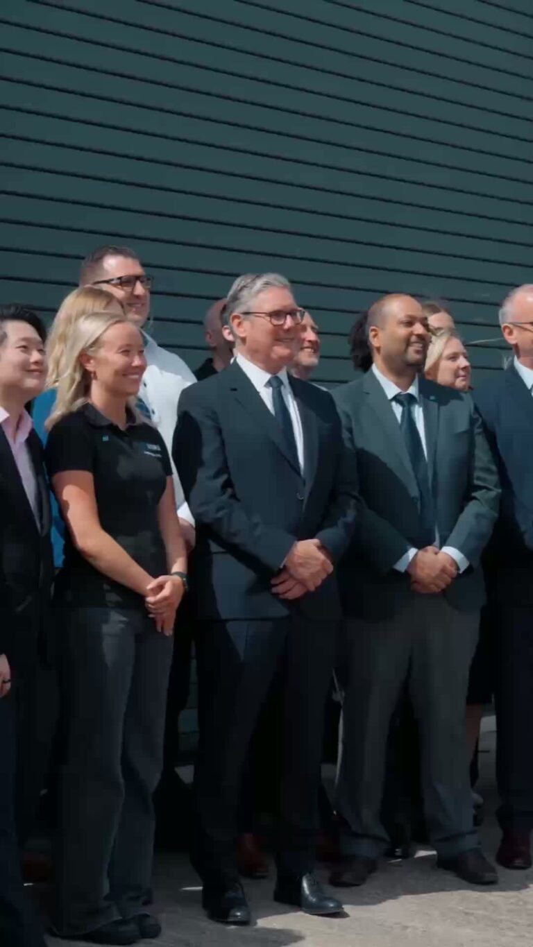 A photo of Prime Minister Keir Starmer and some business people.