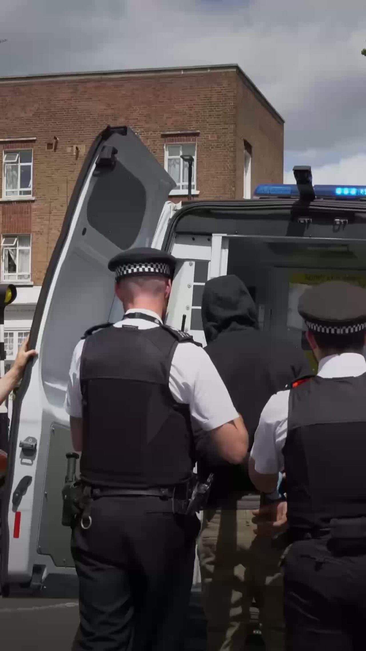 Police Officers arresting someone.