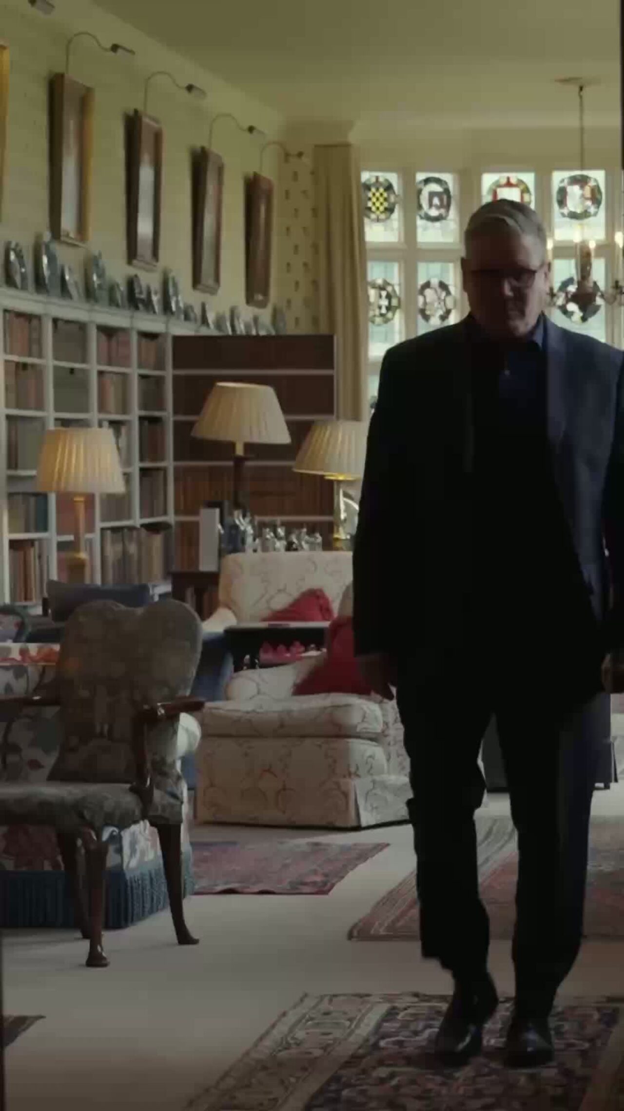 Prime Minister Keir Starmer walking through a room